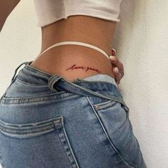 a woman's stomach with the word love written on her lower back and side