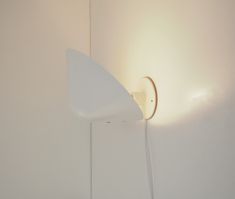 White wall lamp called Vip designed by Jørgen Gammelgaard and manufactured by Danish company Pandul. The lamp was designed during the 1980's. The light is multi-functional with a shade that point up or down and can therefor be used as an up-light, a bed lamp, a downlight or put several on a row in a corridor.  The condition is with small normal signs from many years of use. A little paint is missing on the wall base.  The light comes with a white cord having a plug but it can also be mounted har Flindt Wall Lamp, Lamp Danish, Vipp Lighting, Olafur Eliasson Light, Ferm Living Wall Lamp, Bed Lamp, Wall Lighting Design, Light Sconces, White Wall