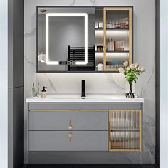 a bathroom vanity with an illuminated mirror above it and drawers below the sink, along with a vase filled with flowers