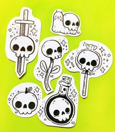 stickers with skulls and bones on them are arranged in the shape of a bottle