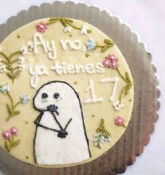 a birthday cake decorated with an image of a seal on it's icing