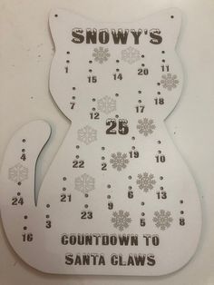 a white clock with snowflakes and numbers on it