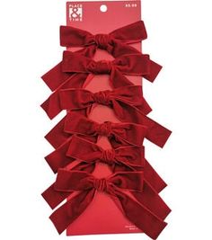 three red bows tied together on top of each other