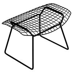 a black and white image of a chair with wire on the legs, it is isolated against a white background