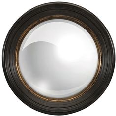 a black and gold framed mirror on a white wall with an oval shape in the middle