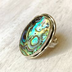 Abalone shell stering ring Unique Shell-shaped Mother Of Pearl Jewelry, Unique Mother Of Pearl Shell Jewelry, Silver Shell-shaped Ring For Gift, Silver Shell Rings For Gift, Oval Mother Of Pearl Ring With Polished Finish, Unique Silver Shell Rings, Unique Silver Shell Jewelry, Unique Sterling Silver Shell Jewelry, Unique Abalone Shell Jewelry