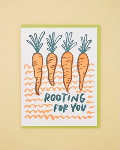 three carrots with the words rooting for you written on them in black ink