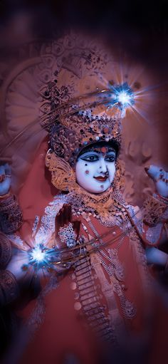 an image of a woman in costume with lights on her head and hands behind her back