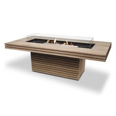 an outdoor table with a glass fire pit on top and wood slats around it