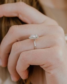 a close up of a person wearing a ring