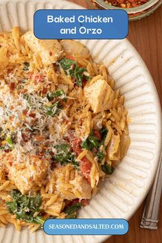 a white plate topped with pasta and chicken