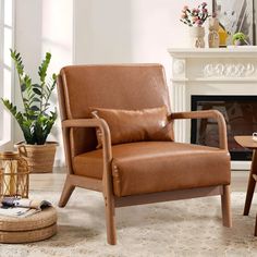 a brown leather chair sitting in front of a fire place next to a wooden table