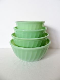 three green bowls stacked on top of each other