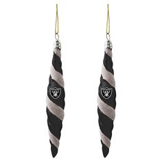 two black and white striped earrings with oakland football logo on the bottom, hanging from gold earwires