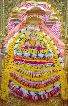 the idol is made up of flowers and other things to decorate it for diwaling