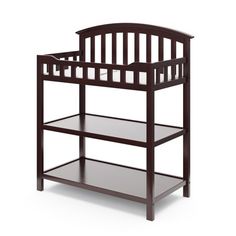 a baby crib that is black and has two shelves on each side, with one shelf below the crib