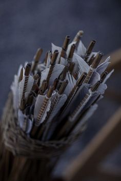 a basket filled with lots of brown and white arrows