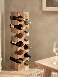 a wooden wine rack holding several bottles of wine