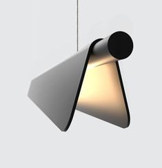 a light that is hanging from a chain on a wall in the shape of a cone