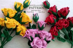 several crocheted roses are arranged on a white surface with the words pattern written below them