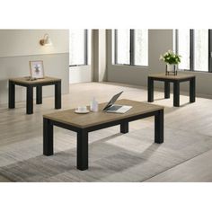 3 piece coffee table set in black and oak finish with two end tables on each side