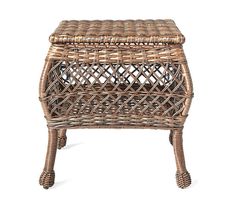 a wicker stool with a lid on it's legs and footrests