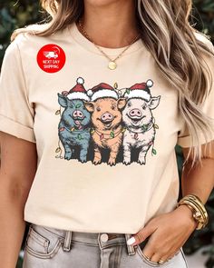 Merry Pigmas T-Shirt, Christmas Pig Shirt, Christmas Pig Shirt, Pig Lover Gift Shirt, Pig Owner Christmas Shirt, Women Christmas Shirt 🌟 Welcome to Custom Style Lab Art! 🌟 We're thrilled to have you here! Thank you for stepping into our store, where you'll discover carefully crafted, high-quality products. Our unique gift options are perfect for surprising your loved ones, friends, family, and colleagues. Each design is created to bring a smile to their faces! Why Choose Us? Our prints are produced using state-of-the-art DTF machines, ensuring bright colors and exceptional quality. Each order is crafted with premium materials to bring your vision to life. Every product you purchase is important to us--we want to accompany you in your most beautiful moments with our high-quality offerings Christmas Shirt Women, Lab Art, Pig Shirt, Pig Shirts, Pig Lovers, Women Christmas, Christmas Women, Beautiful Moments, Christmas Shirt