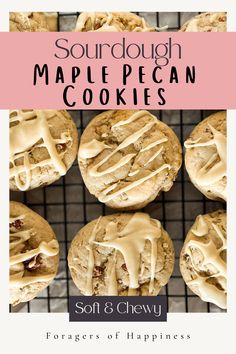 some cookies with icing sitting on top of a cooling rack in front of the words sourdough maple pecan cookies