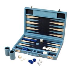 an open backgamzer set with two cups and four pieces in the case on a white background