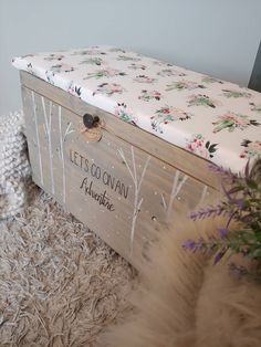 a wooden box sitting on top of a shaggy rug