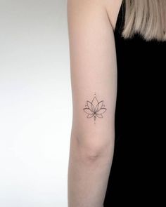 Lotus Flower Tattoos | Tattoofilter Lotus Flower Tattoo Above Elbow, Lotus Flower Back Of Arm, Minimalistic Lotus Tattoo, Tricep Tattoos Women Fine Line, Lotus Tattoo Back Of Arm, Above Elbow Tattoos For Women Simple, Lotus Flower And Breathe Symbol Tattoo, Small Tricep Tattoo Women, Lotus Tattoo Placement