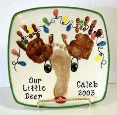 a handprinted plate with the words our little deer and two hands on it