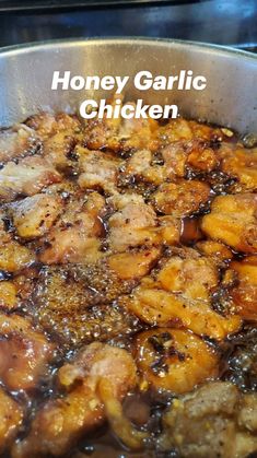 honey garlic chicken is cooking in a pan on the stove with text overlay that reads honey garlic chicken