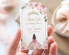 a person holding up a thank you card with a princess dress and tiara on it