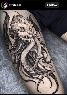 an octopus tattoo on the leg with black ink and white ink, it looks like he is