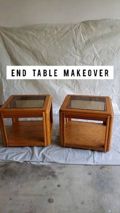 two end tables sitting on top of a white sheet