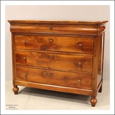 an old wooden dresser with four drawers