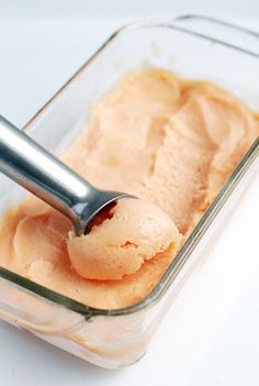 a scoop of ice cream in a glass container