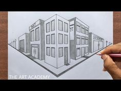 a drawing of a building with the words art academy written on it and someone's hand holding a pencil