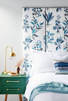 an image of a bedroom with blue and white wallpaper