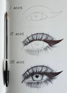 an open book with drawings of different eyes and lashes on it, next to a pen