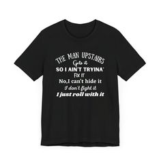 a black t - shirt that says the man upstairss, so i can't try