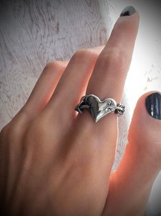 Love Struck Ring ⛓ 100% solid 316L stainless steel 💦 Waterproof 🚫 NO green skin. NO tarnish. NO rust 🖐 Sizes 5-11 available Metalhead Rings, Silver Tarnish Resistant Heart Ring Gift, Edgy Metal Ring Gift, Gothic Stainless Steel Ring As A Gift, Eboy Rings, Gothic Stainless Steel Promise Ring, Silver Grunge Rings For Gifts, Punk Style Stainless Steel Metal Ring Jewelry, Nickel-free Gothic Ring