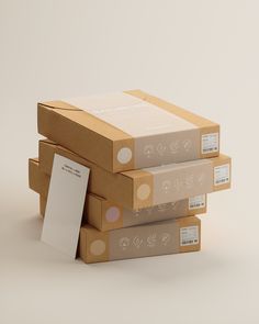 three boxes stacked on top of each other with a paper sticking out of the bottom