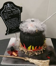 a cake that has been decorated to look like a witch's caulder