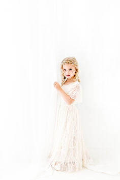 This delicate lace dress is perfect for any wedding, birthday or special occasion! It has creamy ivory or white lace throughout with a beautiful lace sleeve detail. The lace on this one is very soft and comfortable! 🌟 Cream Lace Dress With Scalloped Lace For First Communion, First Communion Scalloped Lace Dress, Cream First Communion Dress With Delicate Lace, First Communion Lace Dress With Scalloped Details, Luxury Cream First Communion Dress With Ruffles, Lace Flower Girl Dress Rustic, Special Occasion Gowns, Flower Girl Dress Lace, Boho Lace