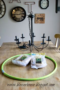 a table that has some bags on it and a light in the middle with a cord attached to it