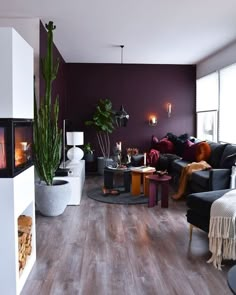 a living room filled with furniture and a fire place