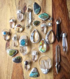 several different types of glass and metal items on a table with scissors, pliers, etc