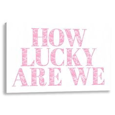 the words how lucky are we written in pink on a white background canvas wall art print